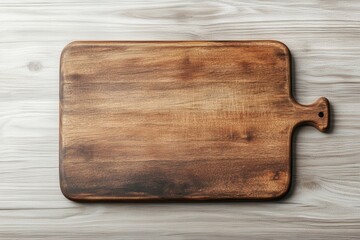 Top view of an empty wooden cutting board on a light wood table. Perfect for food preparation concepts. Rustic and versatile kitchen tool.