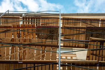 A building with wooden scaffolding on it