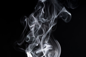 Shapeless smoke is chaotic white on a black background