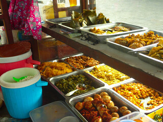 Variety of Traditional Dishes at Indonesian Street Food Stall