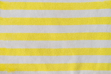 Yellow and white striped fabric background, fabric texture, abstract background.