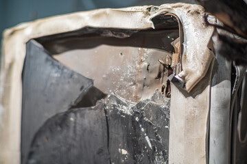 Burning fire in an old broken TV set, toxic air pollution from burning plastics of tube CRT television