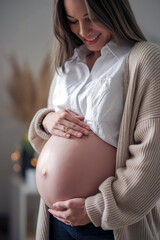 Portrait of a happy pregnant girl with a radiant smile, gently holding her belly. Ideal for showcasing the beauty of motherhood, pregnancy journeys, and family-related themes.