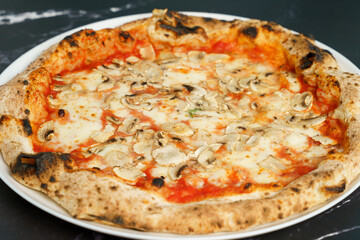 Original Italian pizza with mushroom, cheese and tomato sauce