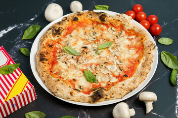 High Angle view of Italian pizza with mushroom, cheese and tomato sauce with ingredients on the table