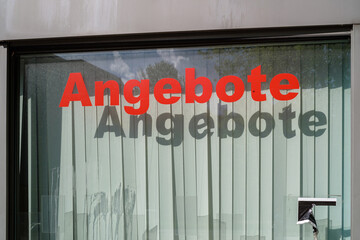 Storefront Window with Angebote (German for "Offers") Sign