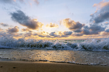 Seascape at sunset. Bright sundown on the sea shore. Sunset on the Baltic Sea.