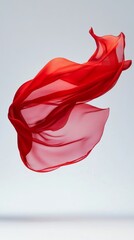 Fototapeta premium Red silk fabric flowing gracefully in the air