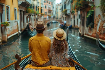 Fototapete couple enjoying a gondola ride in Venice, free space for text © Rayhanbp
