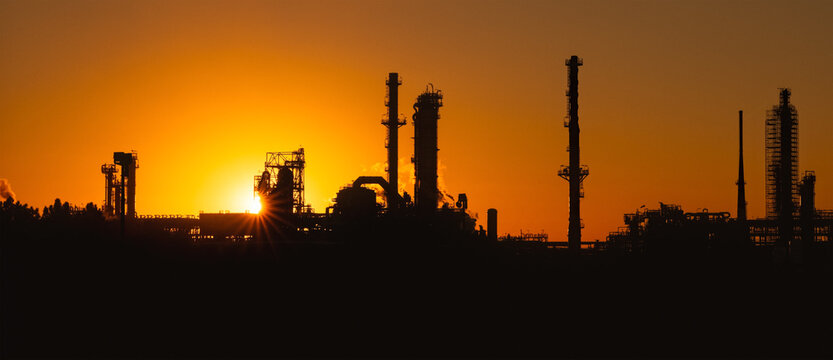 Oil and Gas refinery plant at sunset - Industrial background