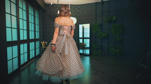 Blonde hair retro lady beauty woman pin up walking high heels classic elegant black shoes in luxury room Vintage dress. Girl sexy fashion model back rear view 30s pin-up Marilyn like Monroe old style