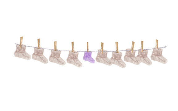 baby socks hanging on a clothesline