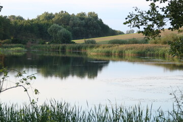 Photos of the lake during sunset from a drone and camera.