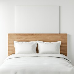A white bed with two pillows and a wooden headboard
