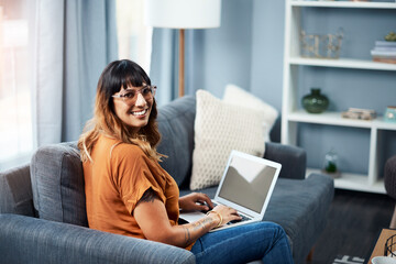 Glasses, relax and woman with laptop, portrait and typing on app, smile and creative in home and...