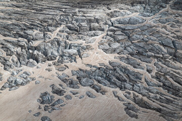 Fototapeta premium Close-up of Mer de Glace glacier covered in red dust