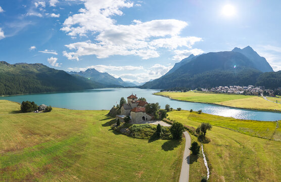 Aerial view of Historic Castle Crap da Sass overlooking Lake Silvaplana, St. Moritz, Grisons Canton, Maloja Region, Switzerland. 