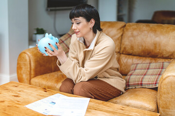 A Thoughtful Moment Reflecting on Savings While Sitting on a Cozy Leather Couch in the Living Room