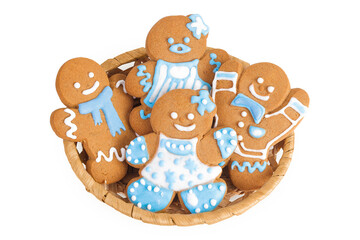 christmas gingerbread cookie in a wicker basket isolated on white background