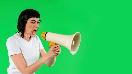 Passionate Activist Delivering a Powerful Message With a Megaphone Against a Vibrant Green Backdrop