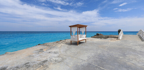 seaside resort beach with white sand and a gazebo for relaxation