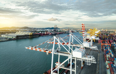 Logistics and transportation of container cargo ship at ship port. Container truck and crane bridge...