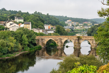 Roman bridge over the river in the city of Lugo, a world heritage site, Galicia.