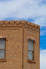 Intricate brickwork on upper story of building