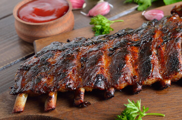 Spicy hot grilled spare ribs on cutting board
