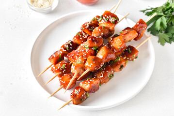 Teriyaki chicken skewers on plate