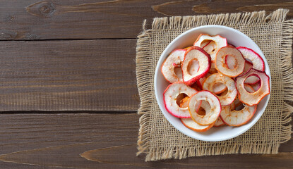  Dried apple rings in white bowl.