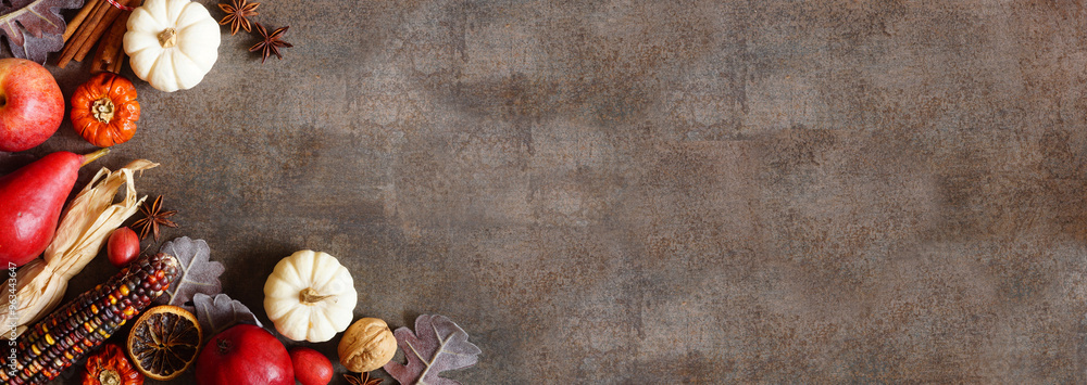 Poster autumn border of pumpkins, leaves and baking spices. corner border on a dark stone banner background