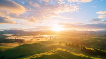 Bright sunrise over rolling hills