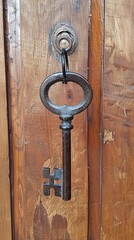 Skeleton key hanging on Solid wood door