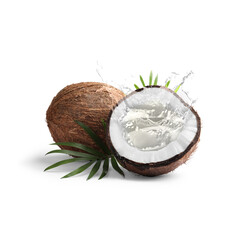Fresh coconut water splashing in nut on white background