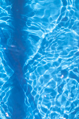 Swimming pool water sun reflection background