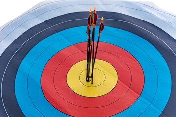 Bottom up view on six arrows hit archery target center with precision shots 1