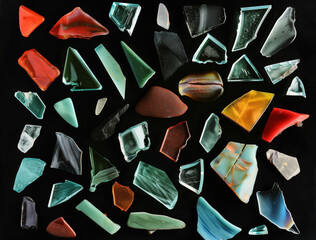 Assorted Glass Fragments on Black Background