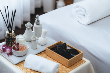 Exquisite display of beauty treatment and spa salon accessories arranged on spa table in luxury spa resort. Relaxing spa massage and recreation background concept. Quiescent