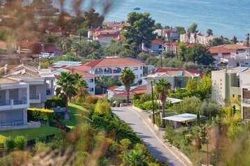Fototapeta premium view of the city and part sea view from hill in pefkochori, greece