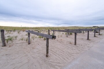 panorama picture, bicycle stand on the beach at the dutch north sea