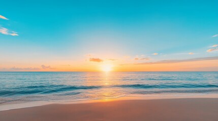 Obraz premium A breathtaking sunset paints the sky in vibrant hues of orange and pink as the sun dips below the horizon, casting a golden glow on the tranquil ocean. Gentle waves lap against the pristine, sandy sho