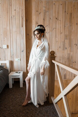 Elegantly Poised Bride in a Rustic Wooden Interior Setting