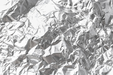 Shiny silver tinfoil surface as background, closeup