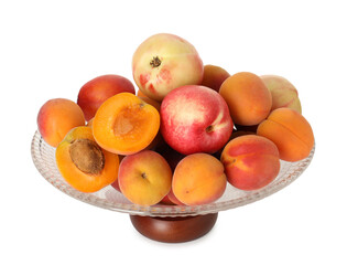Glass vase with different fresh fruits isolated on white