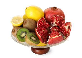 Glass vase with different fresh fruits isolated on white