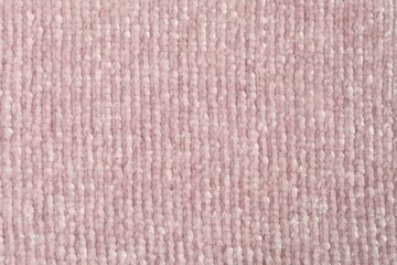 Texture of pink knitted fabric as background, top view