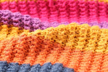 Fototapeta premium Texture of colorful knitted fabric as background, closeup