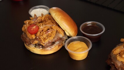 Organic burger made with farm-fresh ingredients served with variety of sauces. Sustainable, tasty...