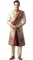 Fototapeta premium A man gracefully presents traditional Thai clothing highlighting rich embroidery and elegance
